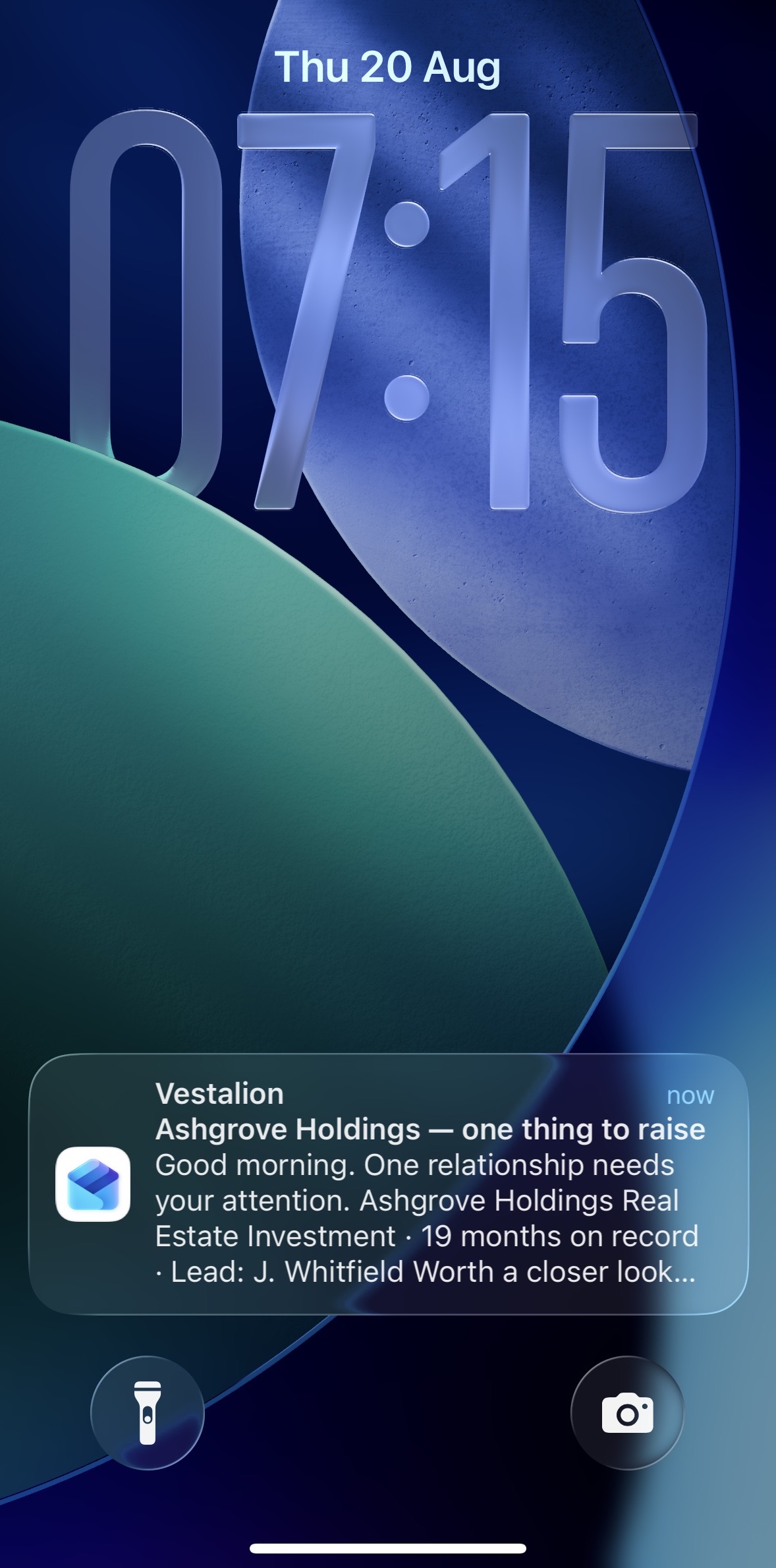 A Vestalion notification on a phone lock screen: Ashgrove Holdings, one thing to raise.